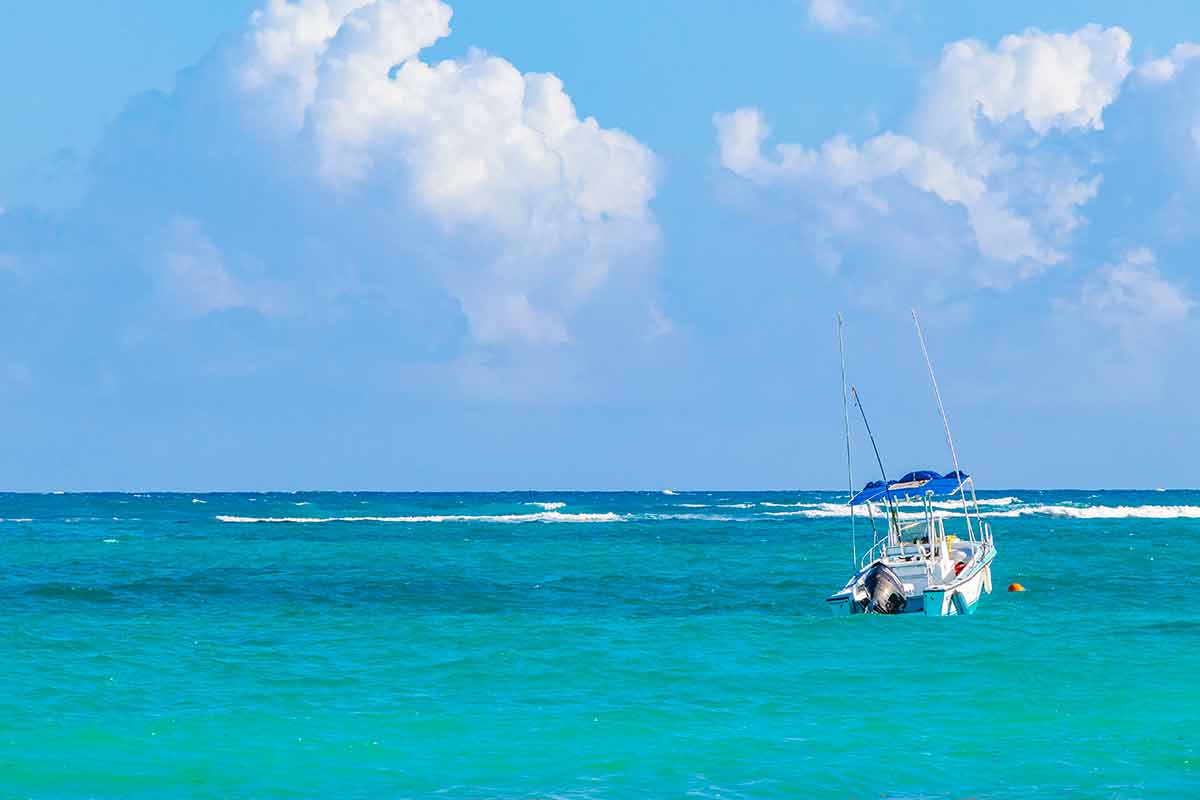 Waves boats caribbean coast and beach