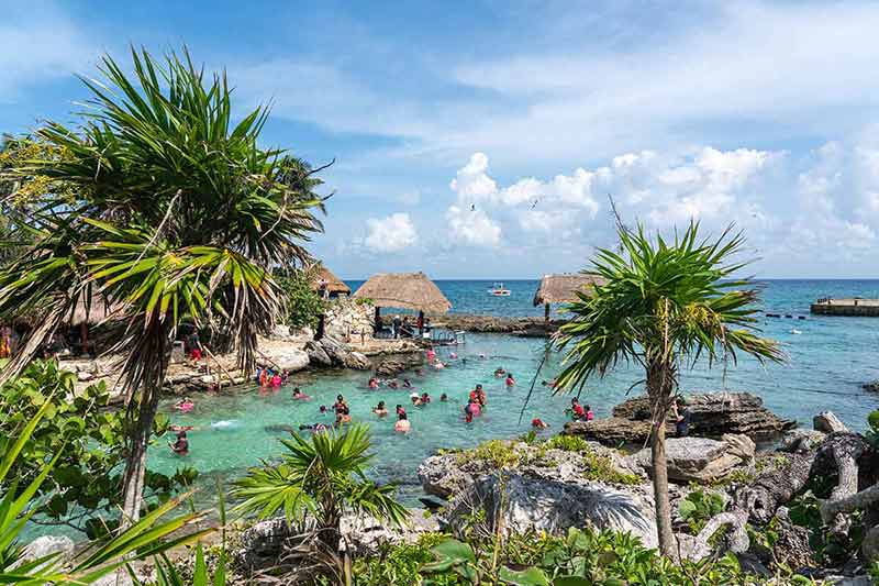 best day trips from cancun lots of people in the water in XCaret park