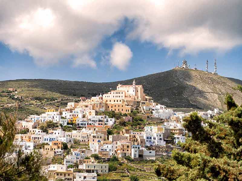 View of Syros town with beautiful buildings and houses in a sunny day.