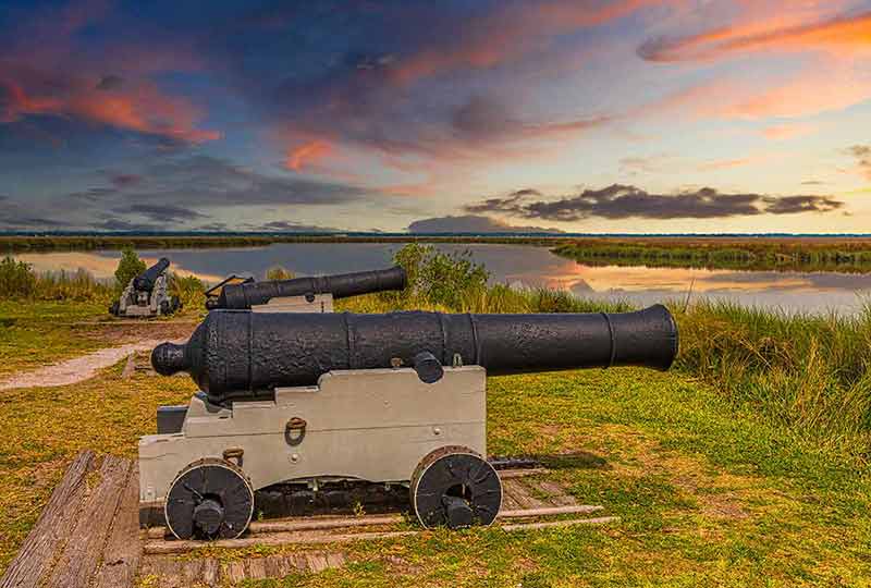 best national parks in georgia cannon in Fort Frederica at dusk