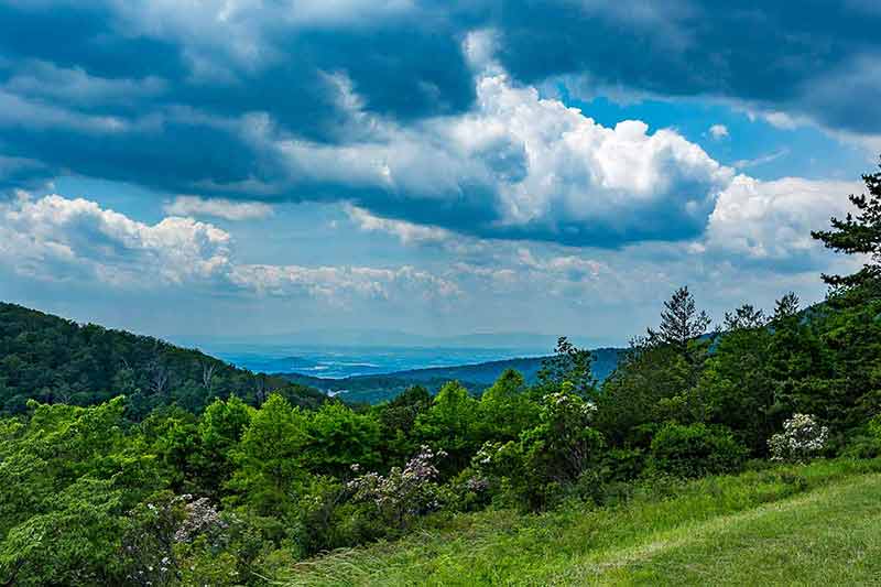 best national parks on the east coast Rain falls in the distance over the Appalachian Mountains
