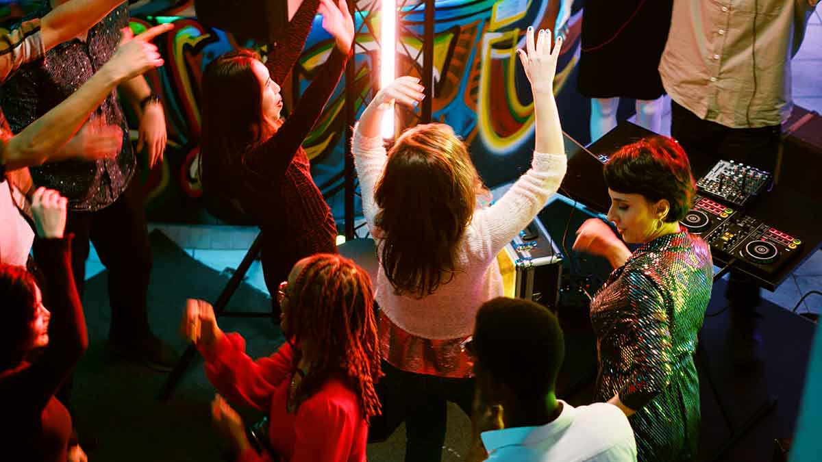 Group Of Young People Partying At Club