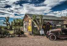 Ghost Towns In Arizona That Look Frozen in Time best preserved ghost towns in arizona Old car wreck left abandoned at the Hackberry General Store