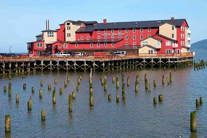 best things to do in astoria oregon red building on a wharf