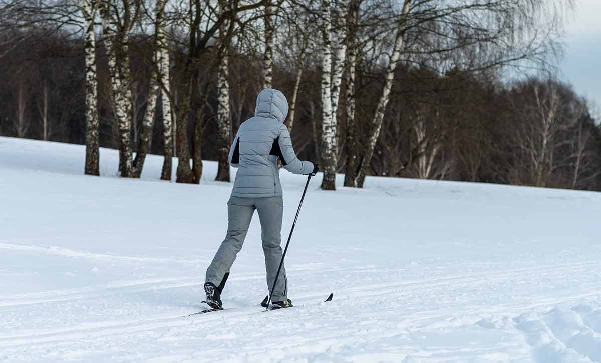 best things to do in breckenridge woman in grey outfit on nordic skis