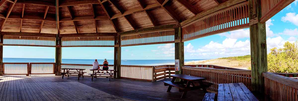 best things to do in fort myers two people sitting in the gazebo looking at the sea