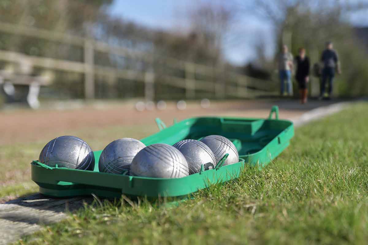 Petanque Balls In A Box On The Grass