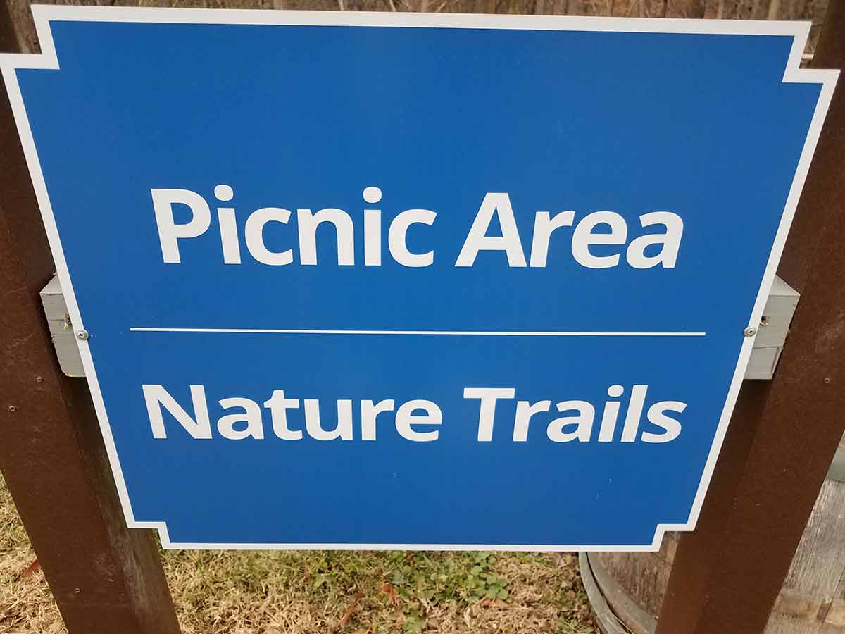 best things to do in pasadena Blue picnic area nature trails sign and wood posts.