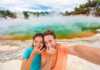 couple holding their noses at the colourful geothermal springs