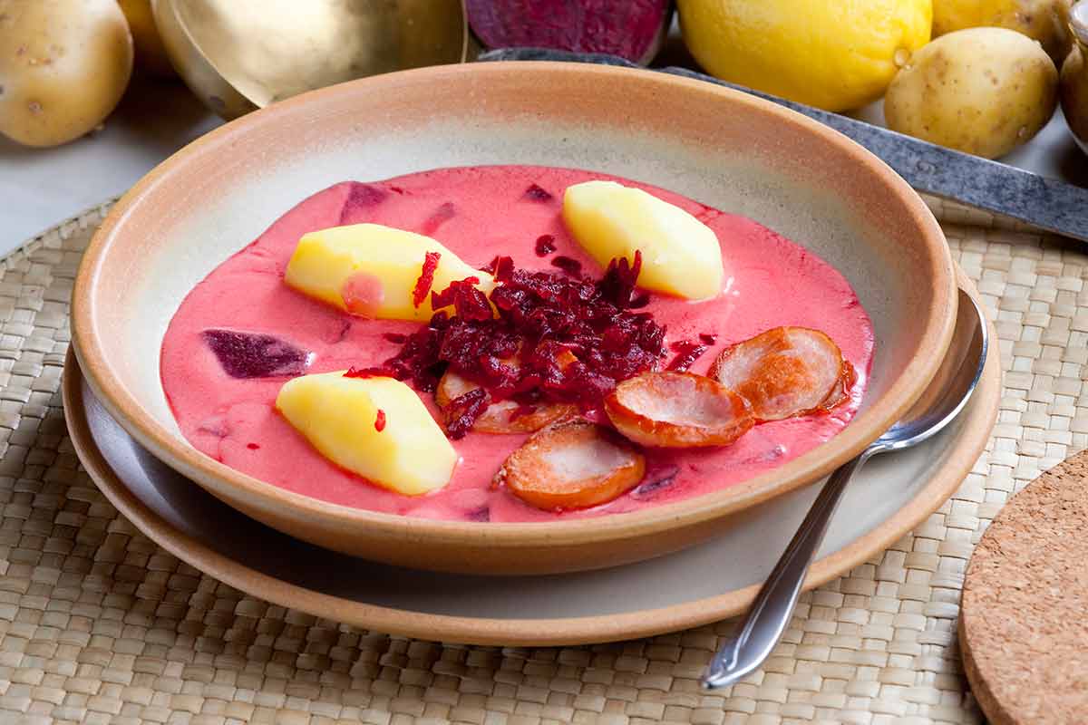 Polish red beet soup in a shallow soup dish