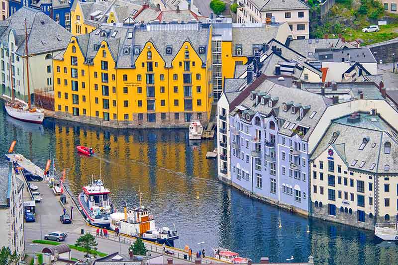 best time of year to visit norway aerial view of colourful buildings on a canal