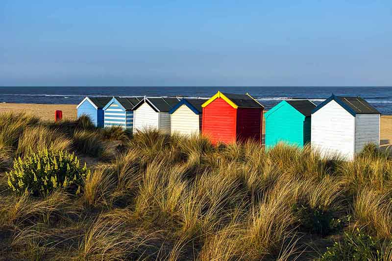 best time to go to england Colourful Beach Huts on Southwold Beach Suffolk