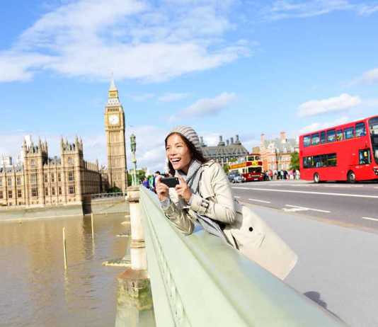 best time to see autumn leaves in london London travel woman tourist by Big Ben