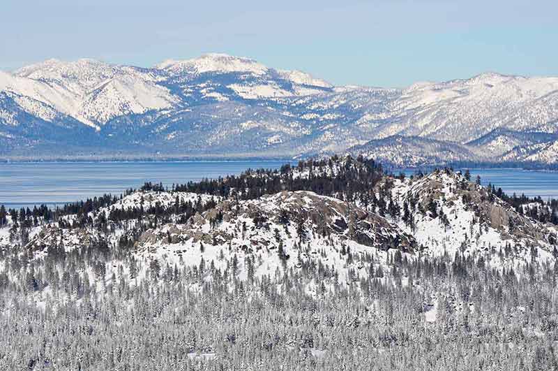 best time to visit California Lake Tahoe snow covered mountains and trees