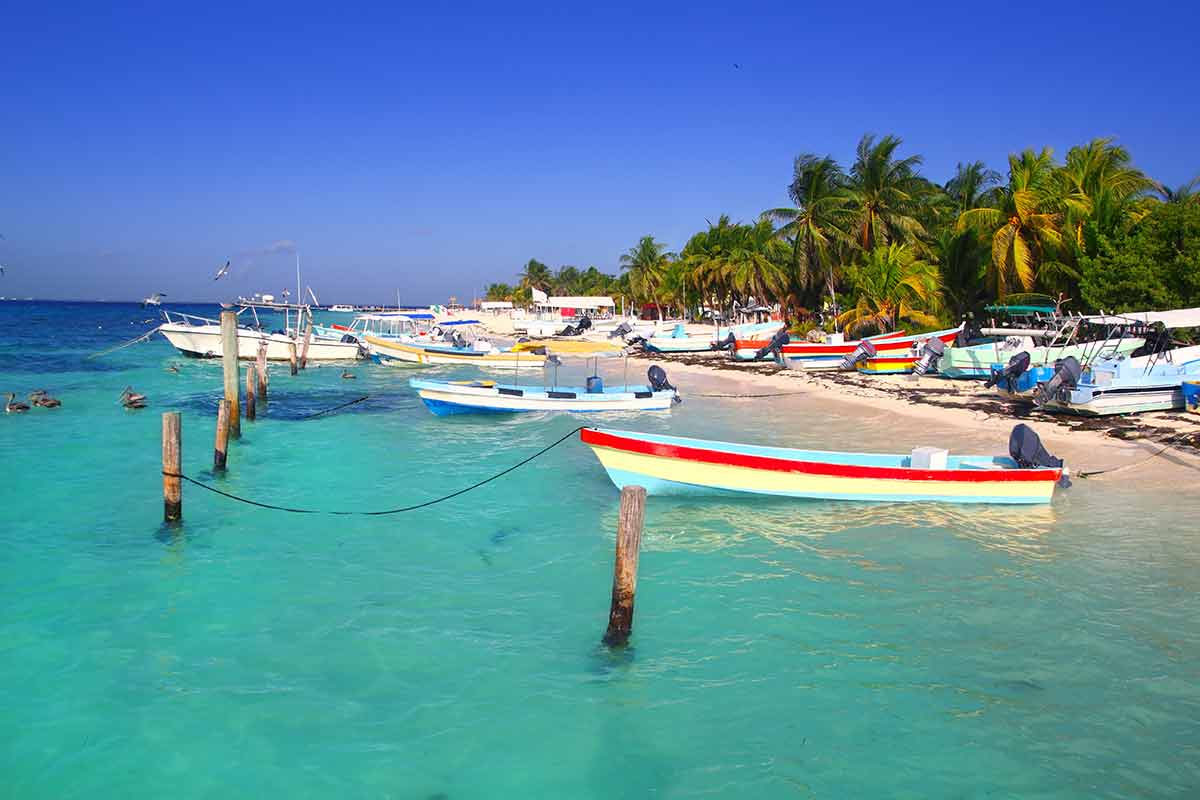 best time to visit Mexico Isla Mujeres colourful boats