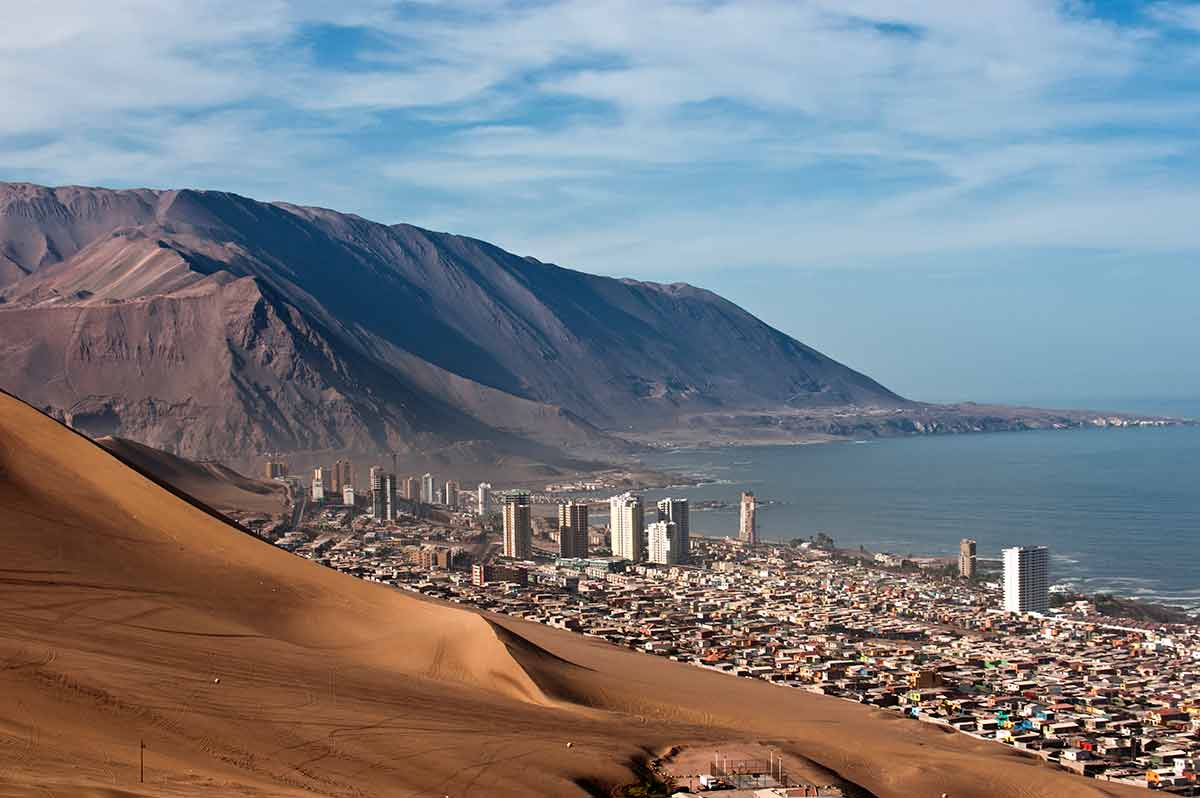best time to visit chile weather Iquique behind a huge dune