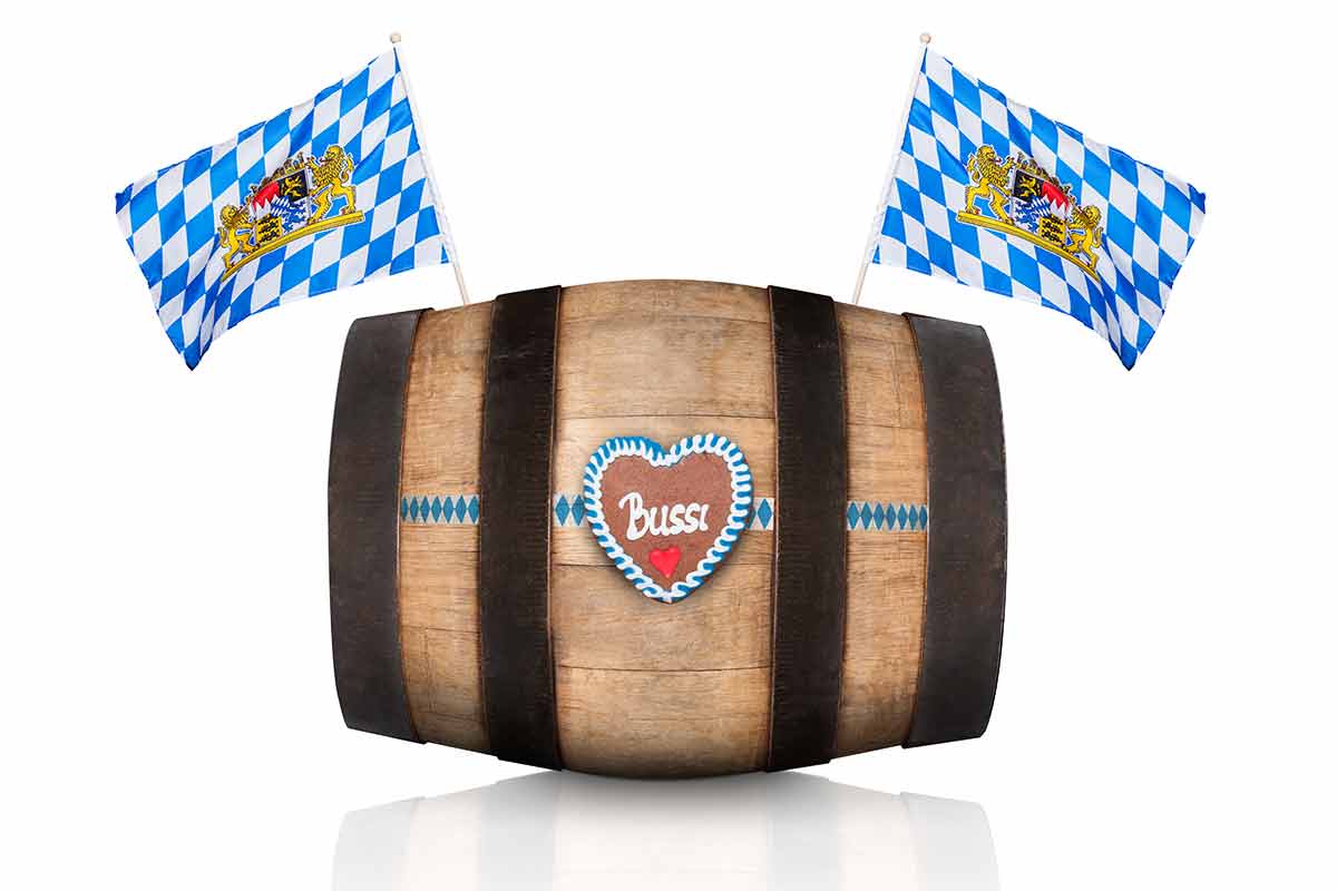 best time to visit germany for oktoberfest Bavarian German beer barrel with flags, isolated on white background, ready for the beer celebration festival in Munich