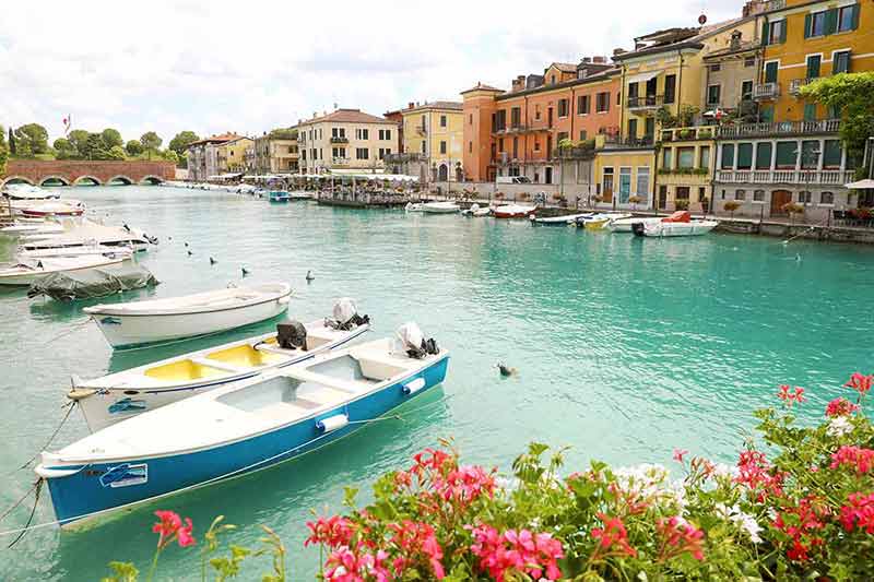 best time to visit italy 2022 boats moored Lake Garda