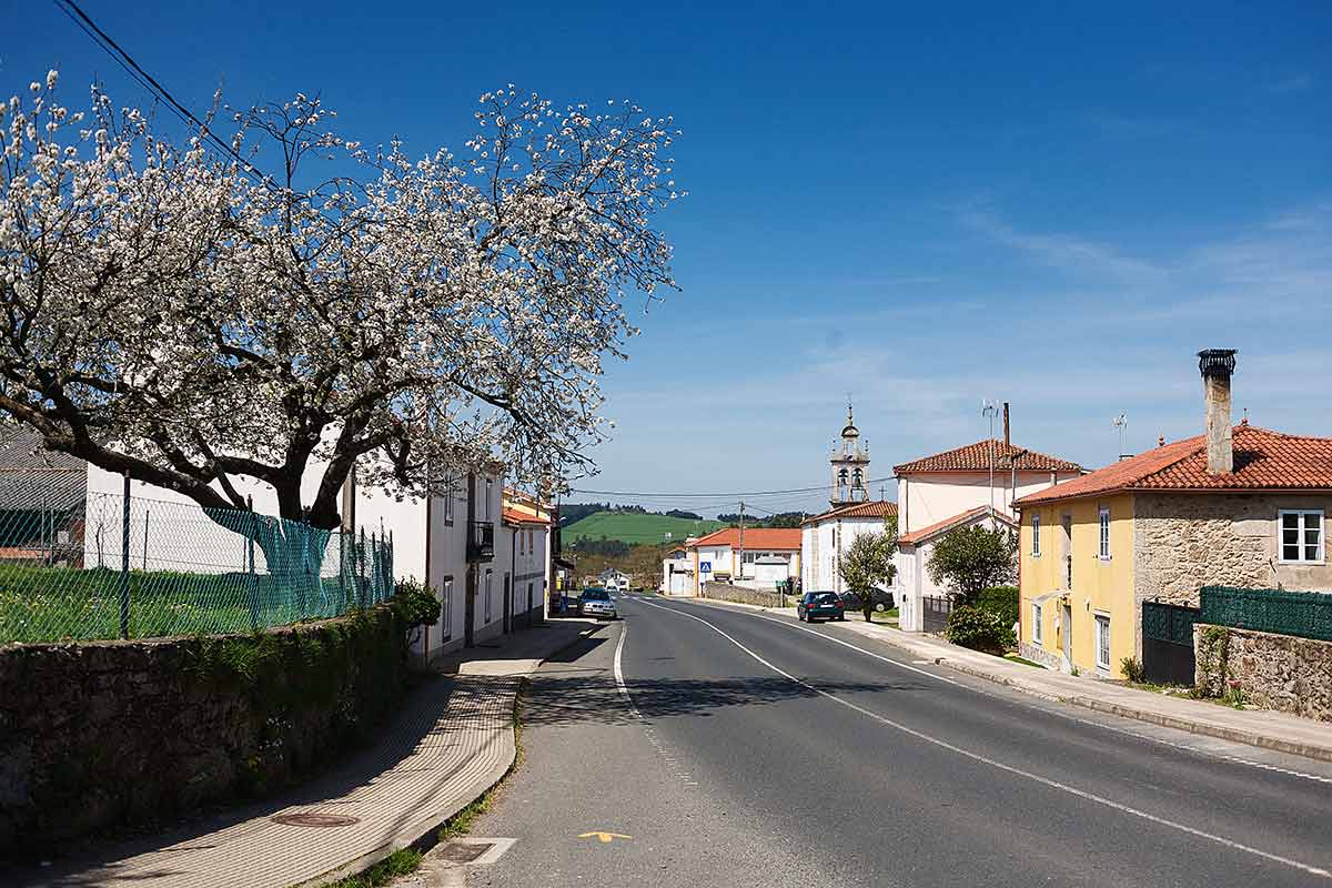 best time to visit seville, spain road in the village of Spain with blue skies in spring.