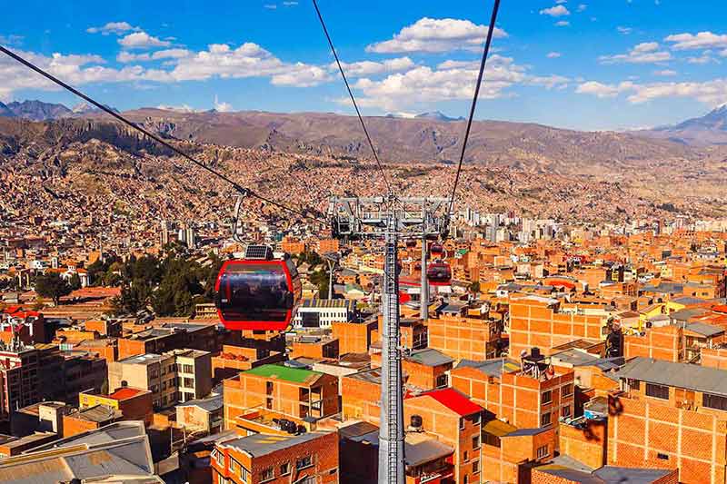 Cable Cars Or Funicular System Over Orange Roofs