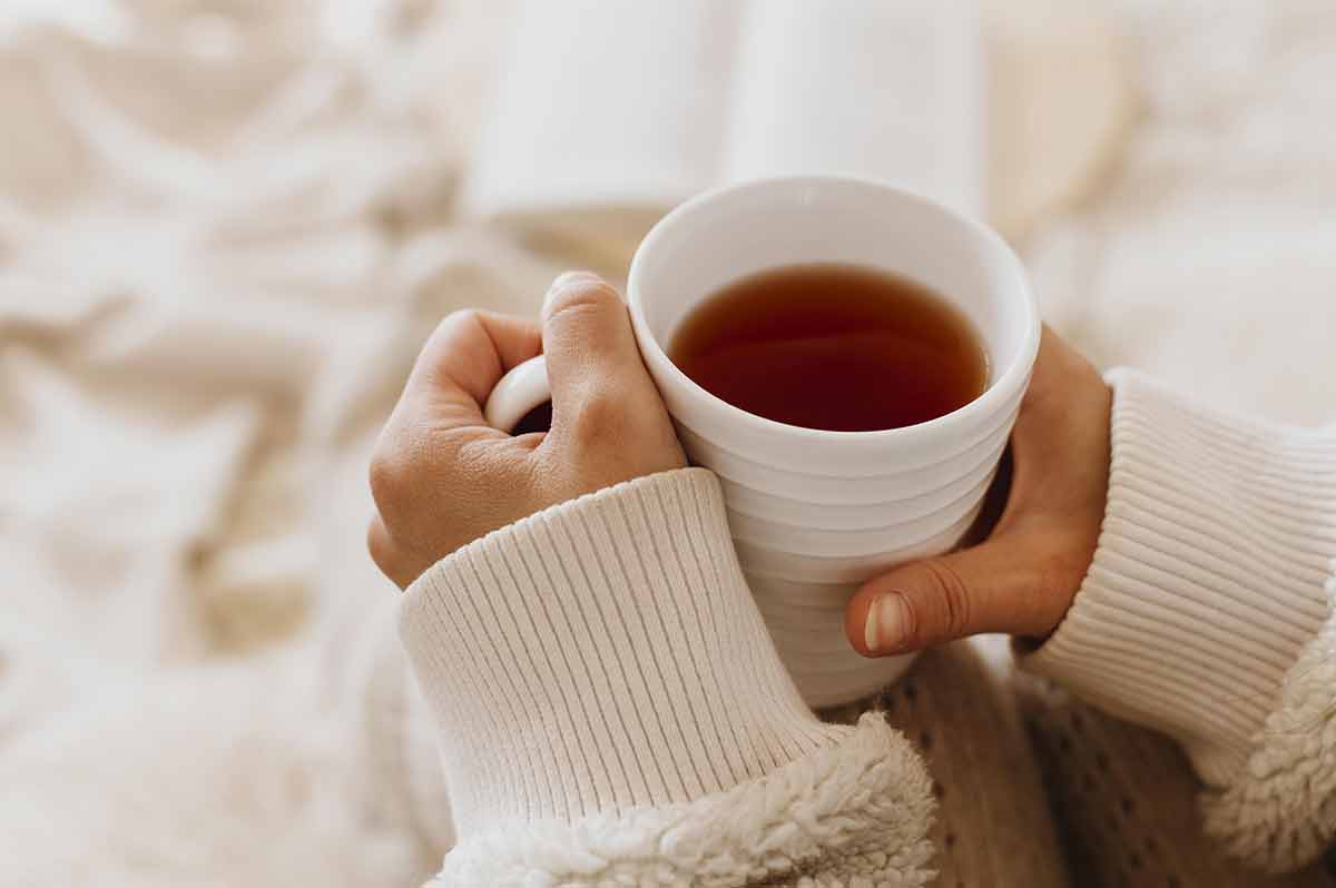british drinks woman's hands holding a mug of tea