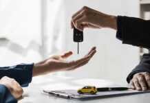 handing over the key to a rental car