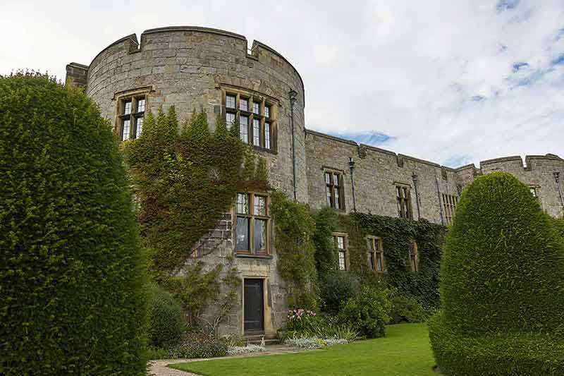 castles to stay in wales Chirk castle with ivy climbing up its walls