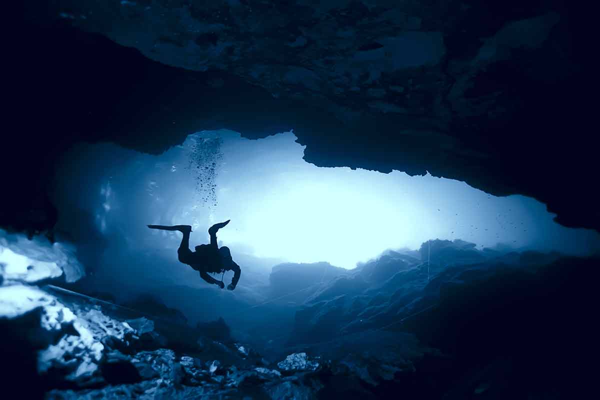 diver in a cavern in the cenotes in yucatan