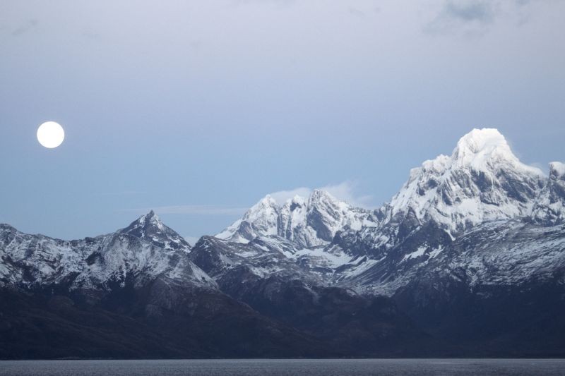 full moon and mountains on our Patagonia cruise