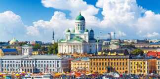 20 Beautiful Cities In Finland That Deserve A Spot On Your Bucket List cities in finland helsinki cathedral and waterfront on a blue-sky day