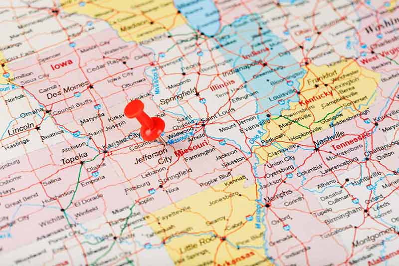 Red clerical needle on a map of USA, Missouri and the capital Jefferson City