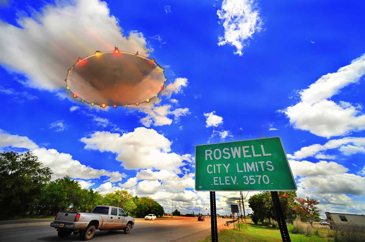 roswell road sign with UFO flying above