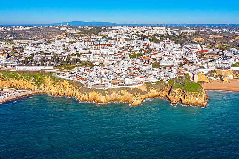 Albufeira in the Algarve Portugal aerial view of white city and cliffs