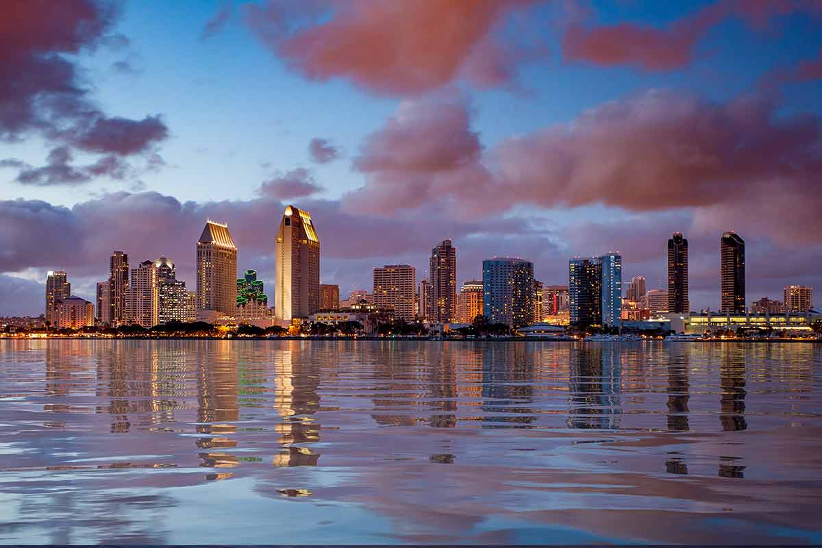 San Diego Skyline At Dusk Reflected In Sea
