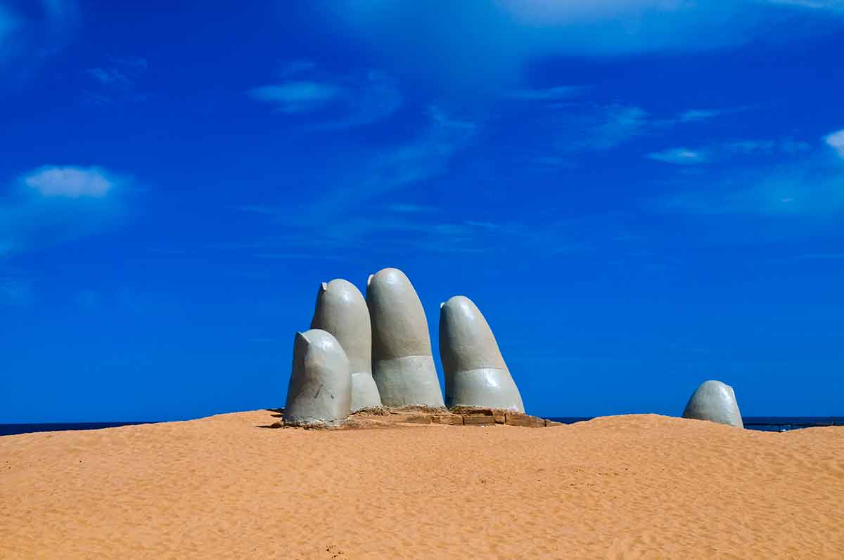 columbia south america beaches "The Hand" a famous sculpture in "Punta del este" Uruguay