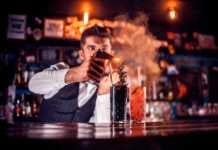 20 West Hollywood Bars That Define LA Nightlife Right Now cool bars in west hollywood Barman makes a cocktail in the bar