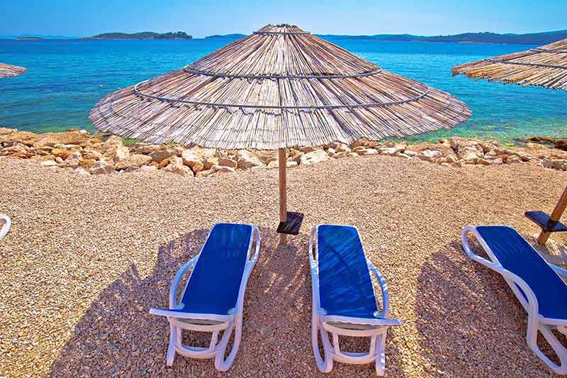 croatia dubrovnik beaches turquoise beach parasol and deck chair