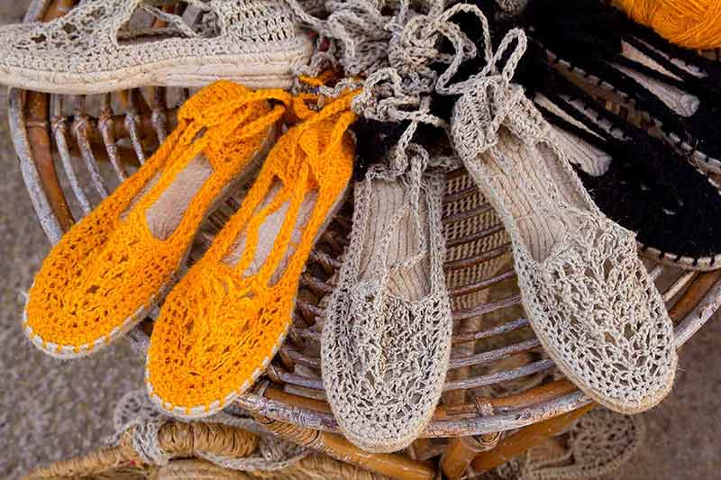 cultural things to do in ibiza orange and cream handwoven shoes