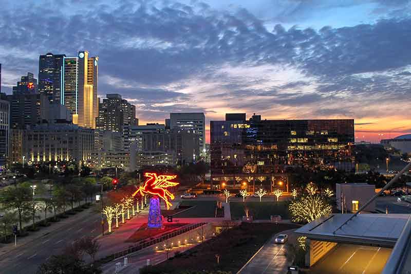 dallas skyline at night with Pegasus sign