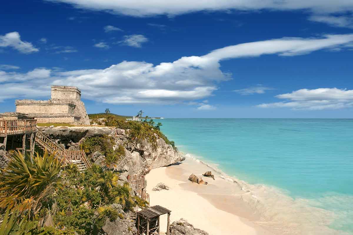 day trips from cancun to tulum blue sea, white sand and ruins