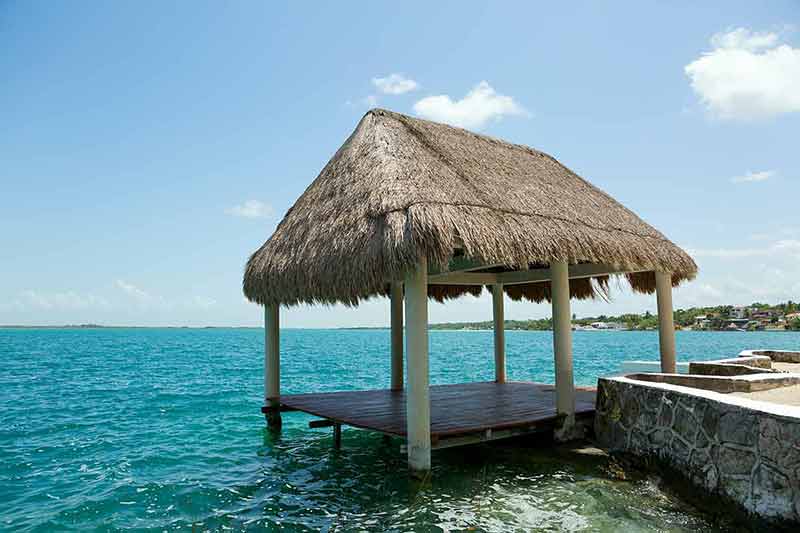 day trips from tulum lake bacalar mexico thatched gazebo on the water