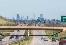 Houston To Denver: The Road Trip From Texas To The Rockies You Need To Do roads in and out of Denver with skyline in the distance
