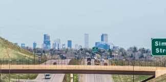 Houston To Denver: The Road Trip From Texas To The Rockies You Need To Do roads in and out of Denver with skyline in the distance