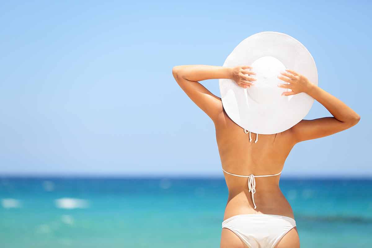 dominican republic beaches woman in white bikini and white hat
