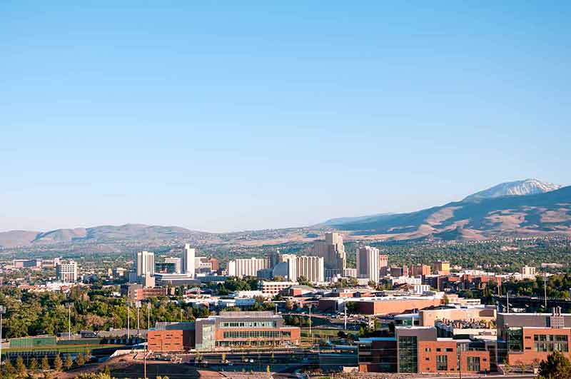 Image of the skyline of Reno, Nevada with the University of Nevada Reno in the foreground.
