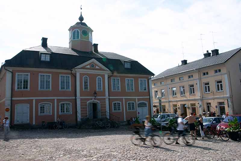 famous cities in finland Porvoo historic square with cyclists