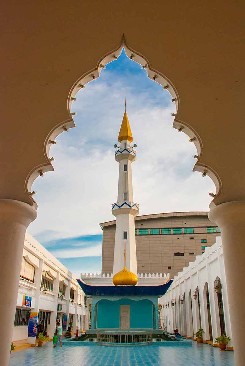 Masjid At-Taqwa Mosque With Its Golden Dome And Palm Trees