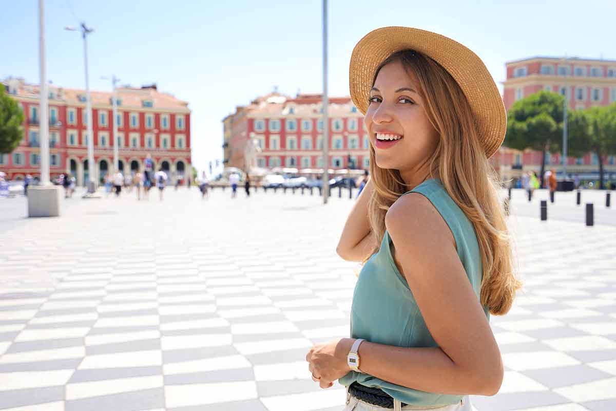 Woman Turns Around And Smiling At Camera In Nice City, France