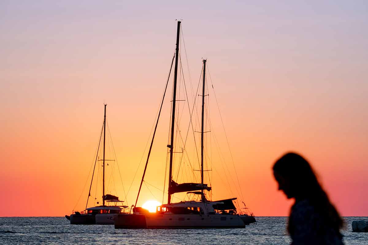 Sailboats Silhouetted In The Sunset