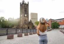 Beautiful Blonde Girl With Hat Walking In Manchester City